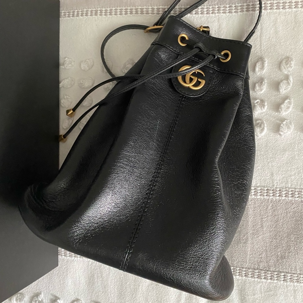 Black drawstring Gucci backpack.